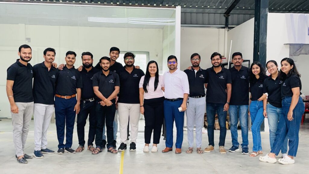 Clinics on Cloud team member smiling health kiosk manufacturing facility